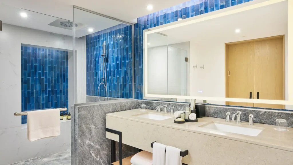Club Deluxe Oceanfront Studio Suite bathroom with walk-in rain shower and double vanity at Hyatt Ziva Los Cabos.