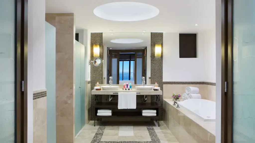 Club One Bedroom Master Suite bathroom with double vanity, jetted tub, and walk-in shower at Hyatt Ziva Los Cabos.
