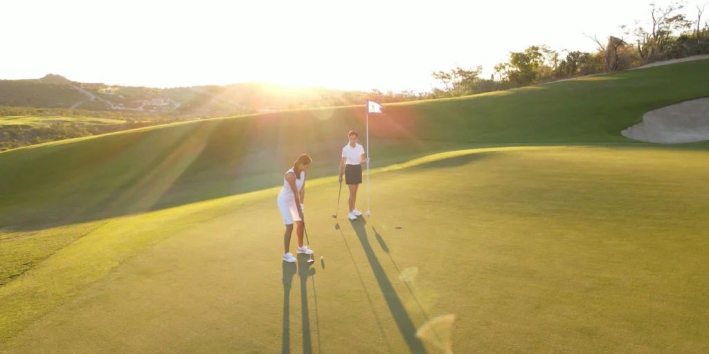 Golfers playing on a championship golf course near Hyatt Ziva Los Cabos with scenic fairways and mountain views.