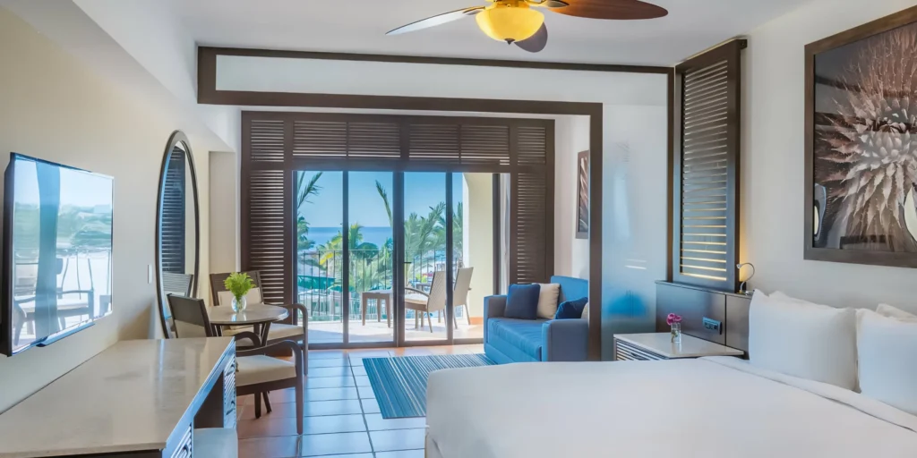 Spacious ocean view guest room with private balcony at Hyatt Ziva Los Cabos.