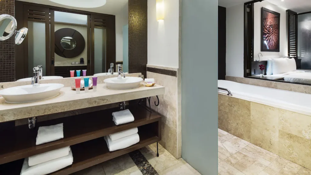 Ocean View Master Double bathroom with double vanity, soaking tub, and walk-in rain shower at Hyatt Ziva Los Cabos.