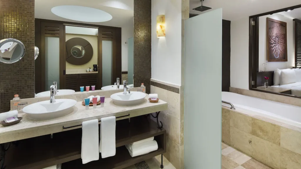 Resort View Master Double bathroom with double vanity, soaking tub, and walk-in rain shower at Hyatt Ziva Los Cabos.