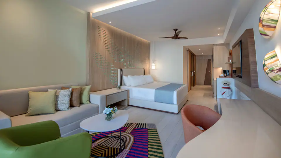 Club Ocean View Junior Suite King with king bed, sitting area, and modern décor at Hyatt Ziva Cap Cana.