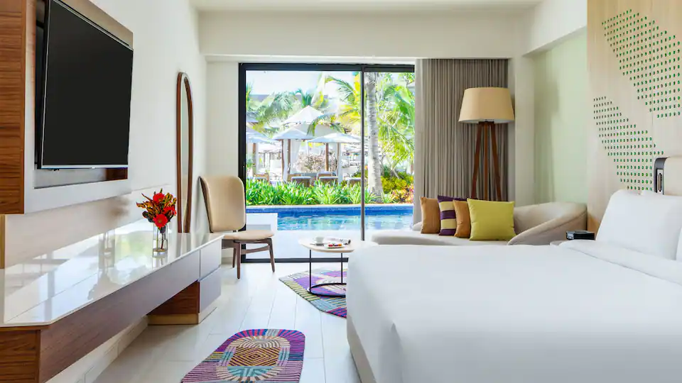King bedroom with pool-view terrace access in the Club One Bedroom Master Swim-Up Suite at Hyatt Ziva Cap Cana.