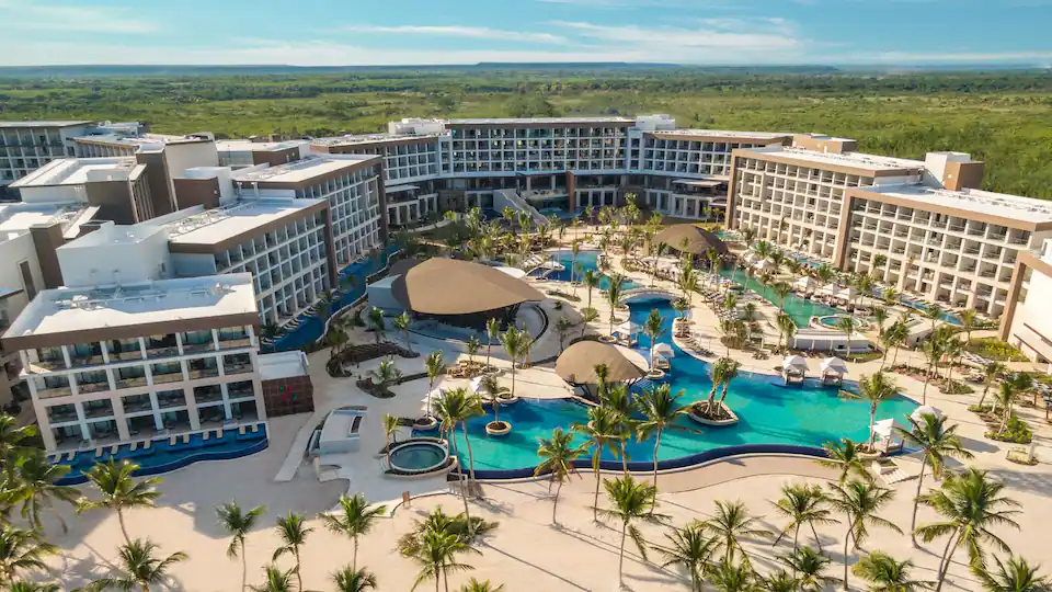 Aerial view of Hyatt Ziva Cap Cana showcasing expansive pools, beachfront accommodations, and tropical landscapes in Punta Cana.