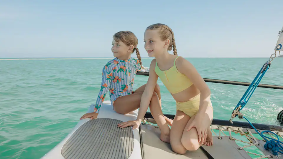Children enjoying a boat excursion in the turquoise waters near Hyatt Ziva Cap Cana in Punta Cana.