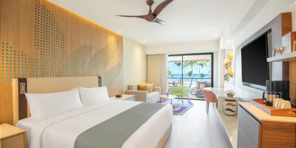 Modern ocean-view guest room at Hyatt Ziva Cap Cana featuring contemporary furnishings, luxury amenities, and a private balcony.
