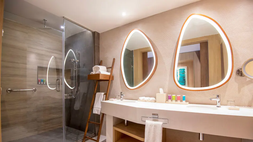 Junior Suite Double bathroom with dual vanity and walk-in shower at Hyatt Ziva Cap Cana.