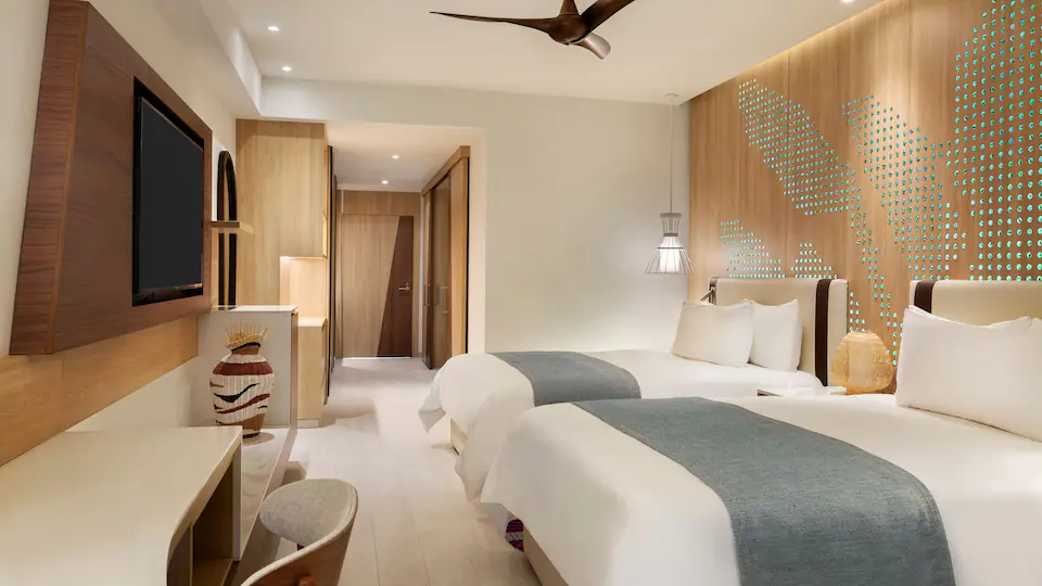 Junior Suite Double bedroom with two queen beds at Hyatt Ziva Cap Cana.