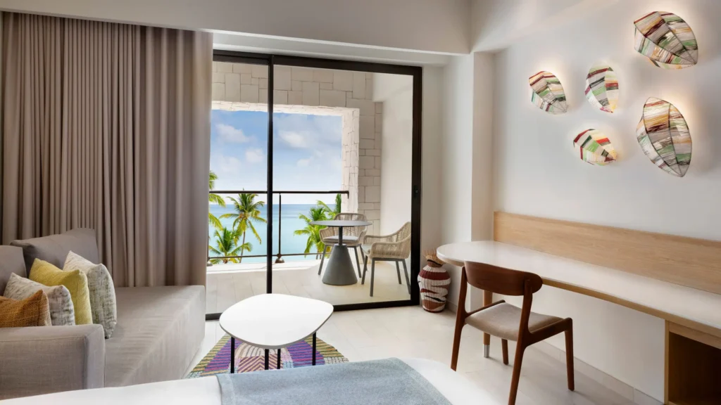 Ocean View Junior Suite Double living area with balcony overlooking the Caribbean Sea at Hyatt Ziva Cap Cana.
