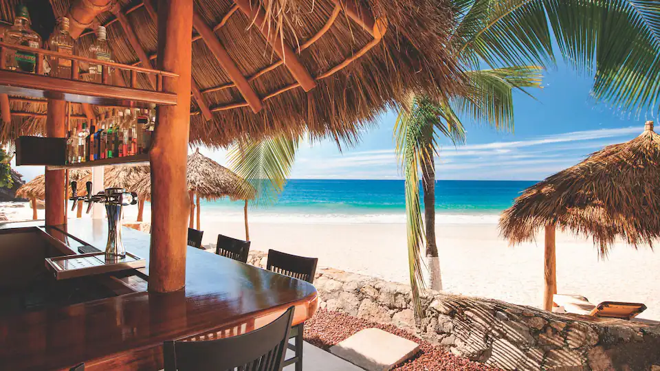 Bar Tortugas at Hyatt Ziva Puerto Vallarta featuring a relaxed poolside setting, tropical cocktails, and stunning views of Banderas Bay.