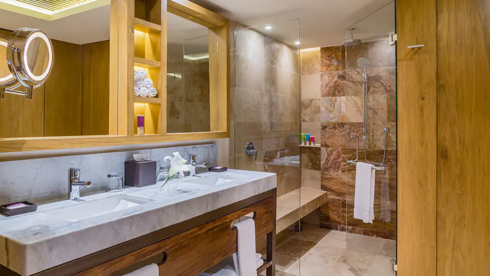 Club Ocean View Swim-Up Suite King bathroom with double vanity and walk-in shower at Hyatt Ziva Puerto Vallarta.
