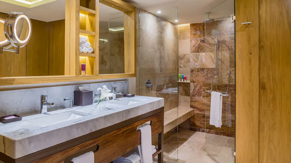 Club Oceanfront Hot Tub King bathroom with double vanity and walk-in shower at Hyatt Ziva Puerto Vallarta.