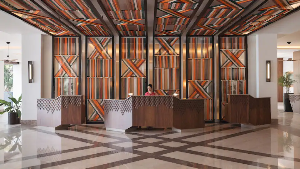 Modern reception area at Hyatt Ziva Puerto Vallarta featuring elegant design and welcoming service.