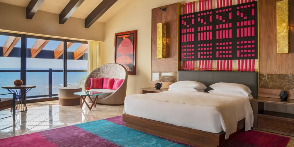 Elegant ocean-view bedroom in the Presidential Suite at Hyatt Ziva Puerto Vallarta featuring contemporary Mexican-inspired décor.