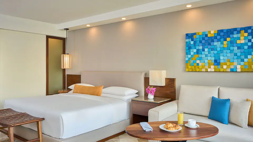 Ocean View King room with king bed and seating area at Hyatt Ziva Puerto Vallarta overlooking the Pacific Ocean.
