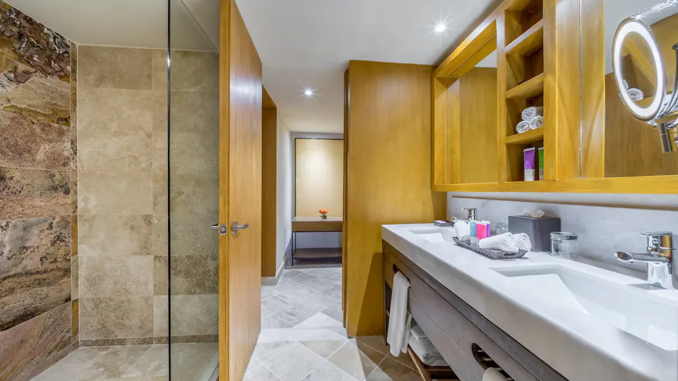 One Bedroom Plunge Pool Suite King bathroom with double vanity and walk-in shower at Hyatt Ziva Puerto Vallarta.