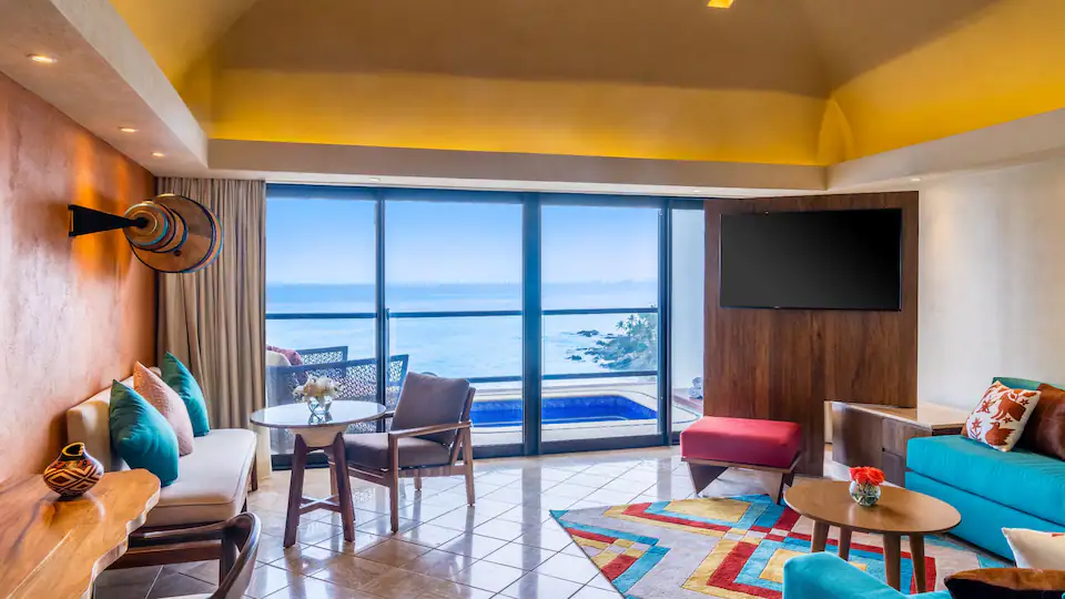 One Bedroom Plunge Pool Suite King living area with oceanfront balcony at Hyatt Ziva Puerto Vallarta.