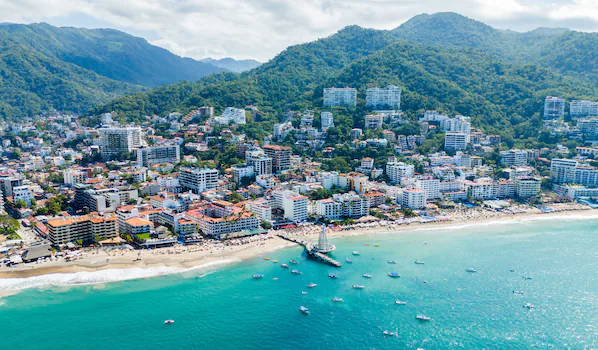 Playa de los Muertos near Hyatt Ziva Puerto Vallarta featuring a lively beachfront, golden sands, and stunning Banderas Bay views