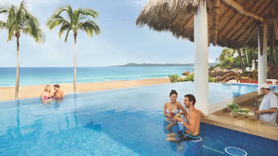 Pool Bar at Hyatt Ziva Puerto Vallarta featuring refreshing cocktails, swim-up service, and scenic oceanfront pool views.