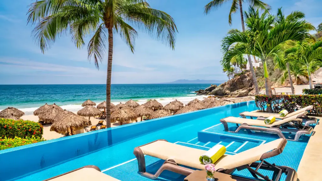 Semi-private swim-up pool overlooking the beach from the Swim-Up Double room at Hyatt Ziva Puerto Vallarta.