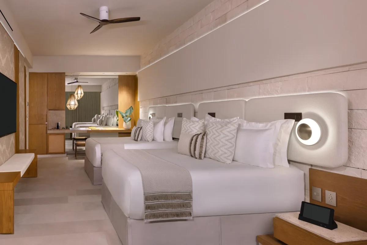 Junior Suite Double with two queen beds and modern décor at Impression Isla Mujeres by Secrets.