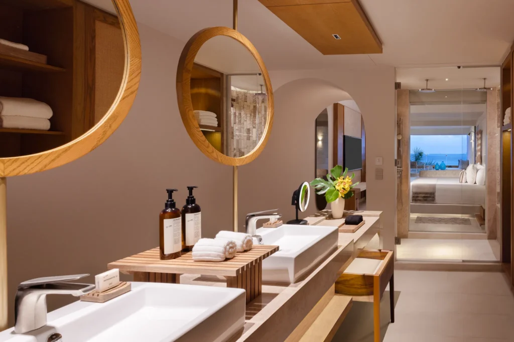 Spacious double vanity bathroom with modern design in Paramount Suite Ocean Front at Impression Isla Mujeres by Secrets.