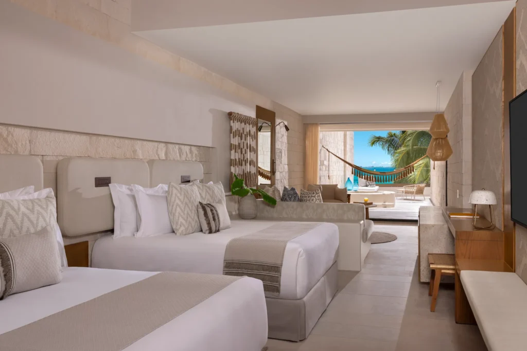 Signature Junior Suite Double Ocean View with two queen beds and Mayan tub at Impression Isla Mujeres by Secrets.
