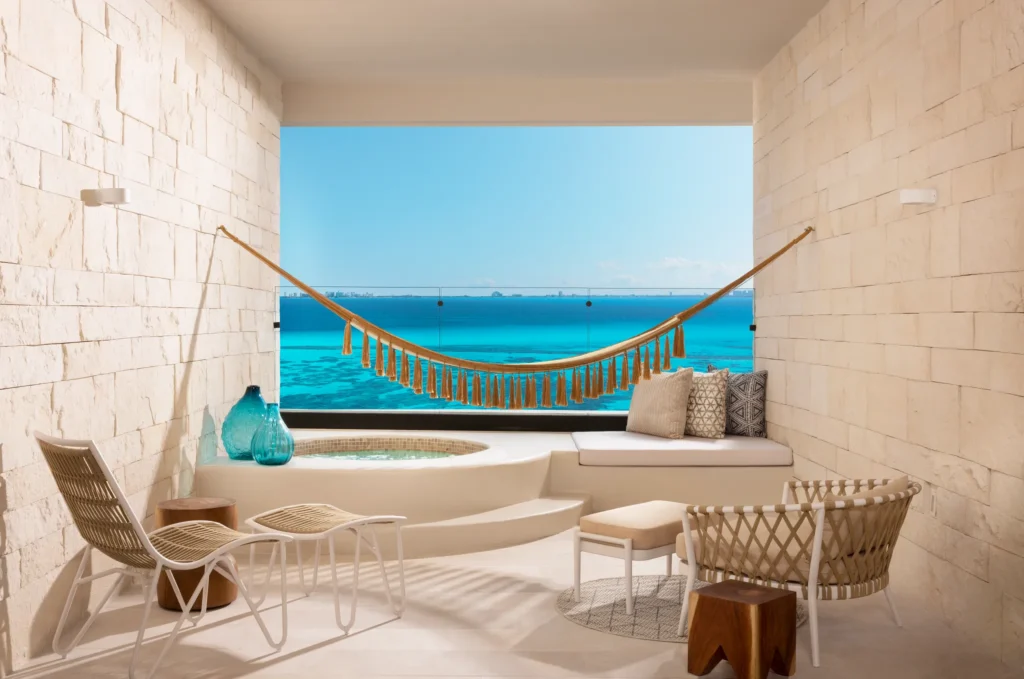 Private terrace with Mayan tub and hammock overlooking the ocean in Signature Junior Suite at Impression Isla Mujeres by Secrets.