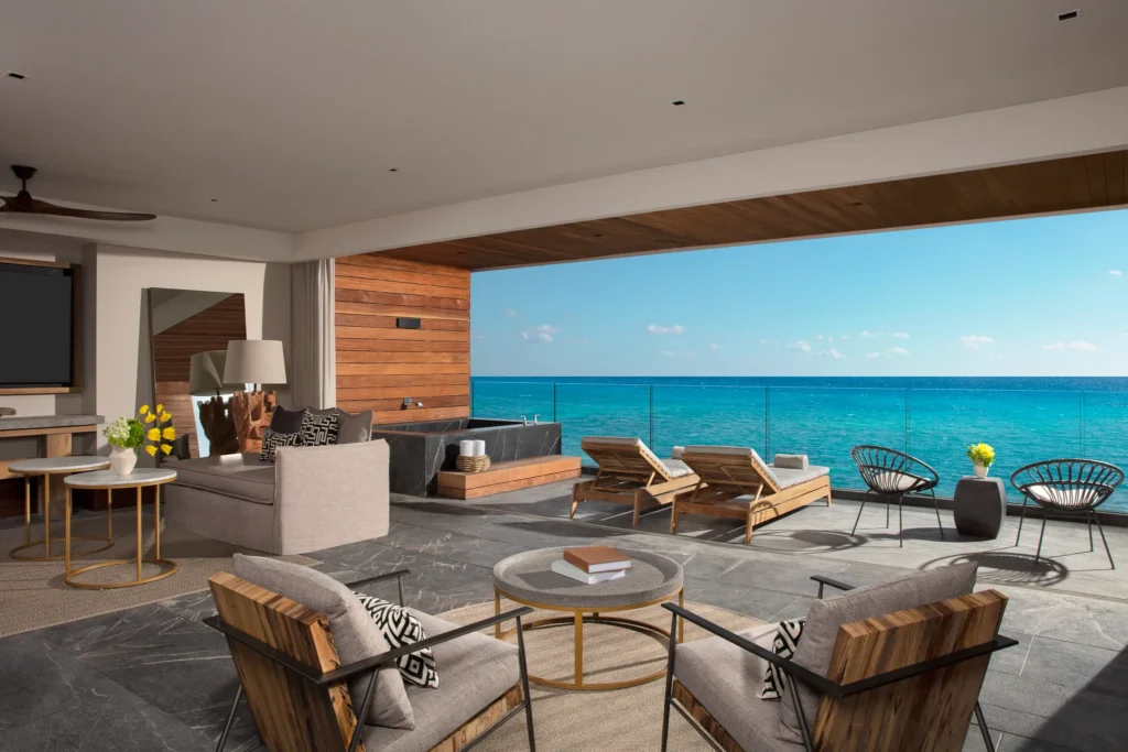 Master Suite Ocean Front living room opening to private oceanfront terrace at Impression Moxché by Secrets.
