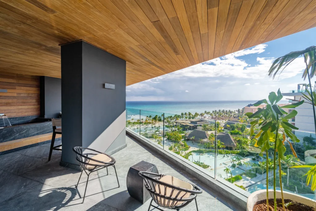 Master Suite Ocean View balcony with panoramic Caribbean Sea views at Impression Moxché by Secrets.