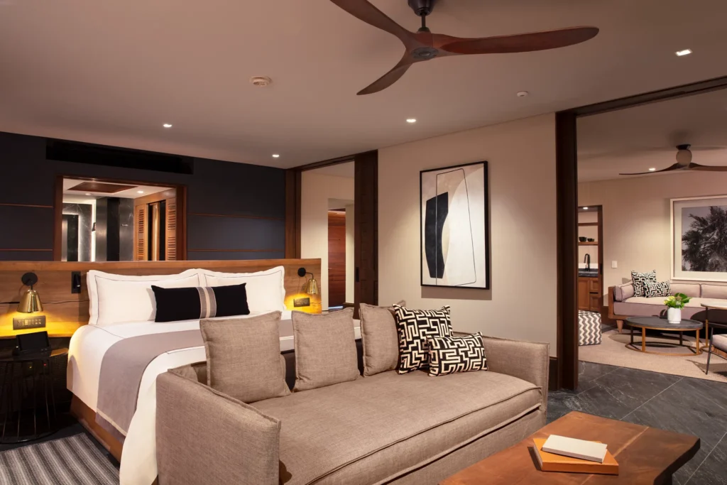 Master Suite Ocean View bedroom with king bed and separate living area at Impression Moxché by Secrets.
