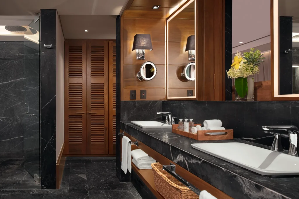 Master Suite Swimout Tropical View bathroom with dual sinks and rain shower at Impression Moxché by Secrets.