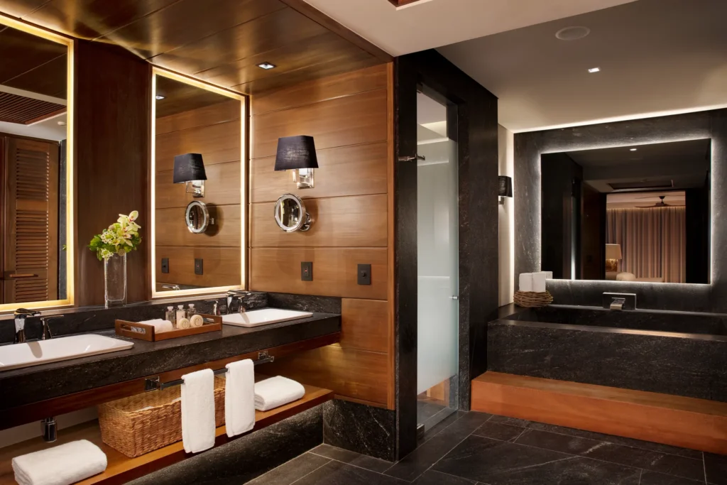 Signature Suite Ocean View bathroom with freestanding soaking tub and rain shower at Impression Moxché by Secrets.