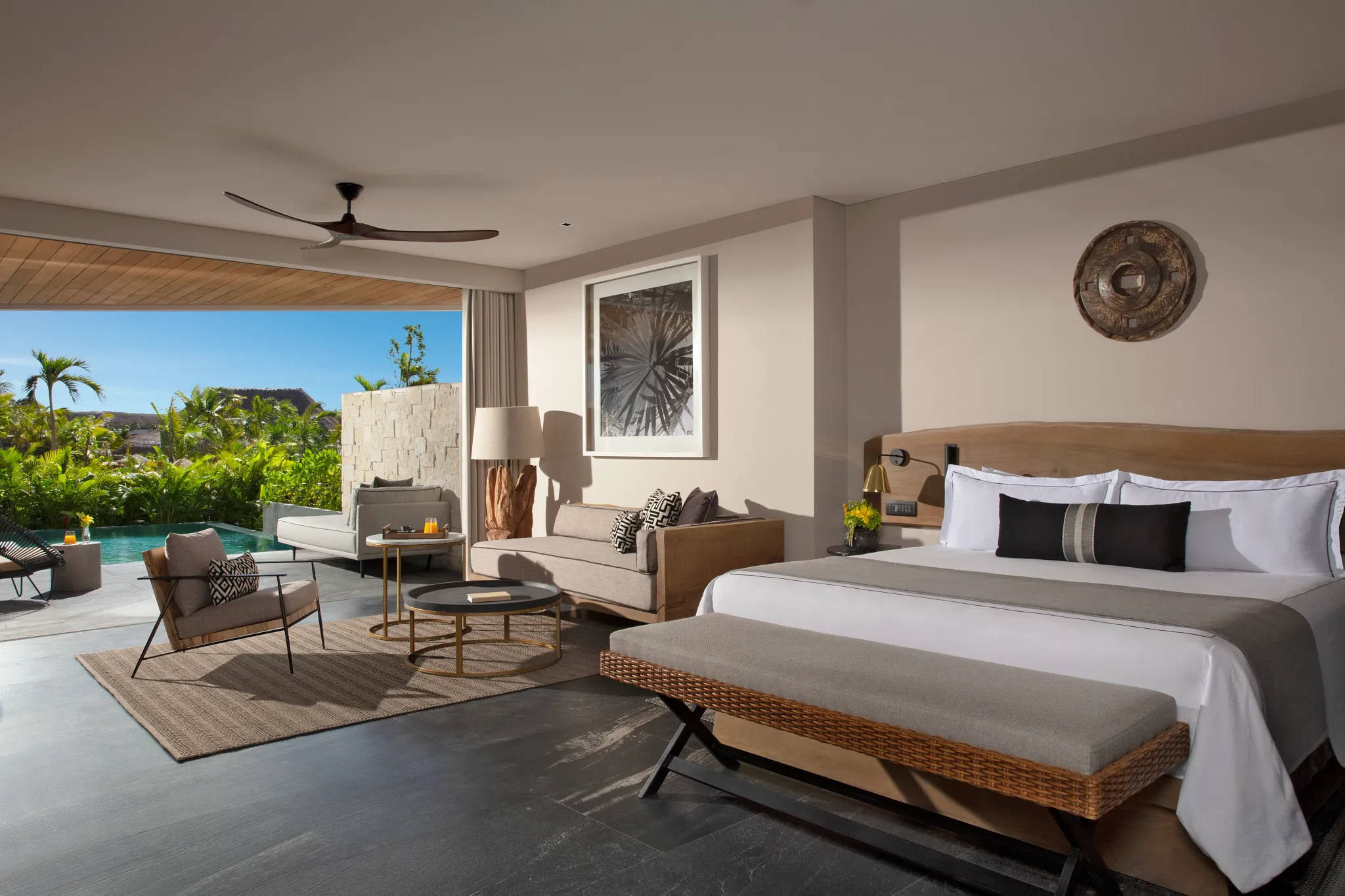Signature Swimout Suite Tropical View bedroom with king bed and direct access to private pool at Impression Moxché by Secrets.