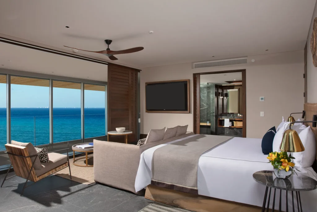 Two Story Penthouse Suite Ocean Front king bedroom with ocean views at Impression Moxché by Secrets.
