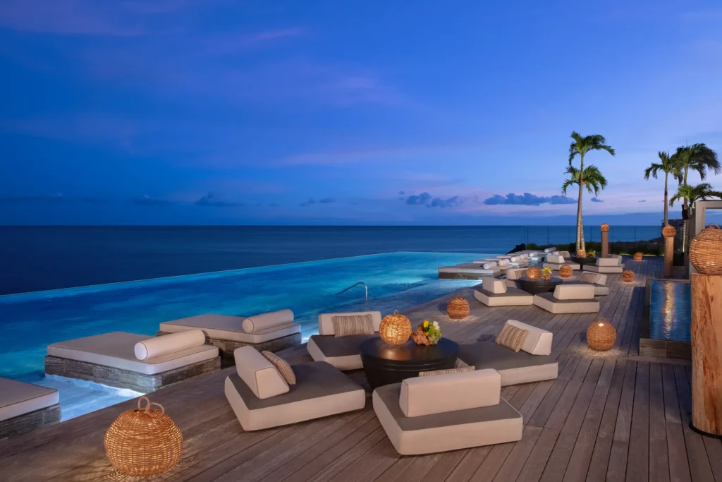 Rooftop infinity pool cocktail setup overlooking the ocean at Impression Moxché by Secrets in Playa del Carmen