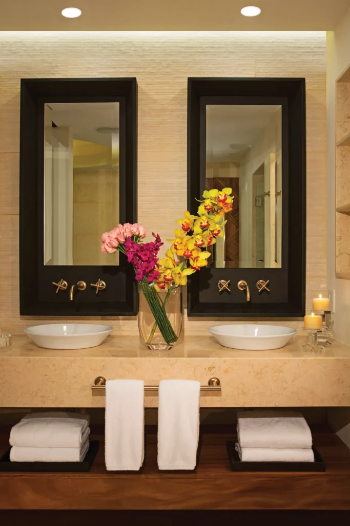 Preferred Club Junior Suite Ocean View double vanity with modern mirrors at Secrets Akumal Riviera Maya.