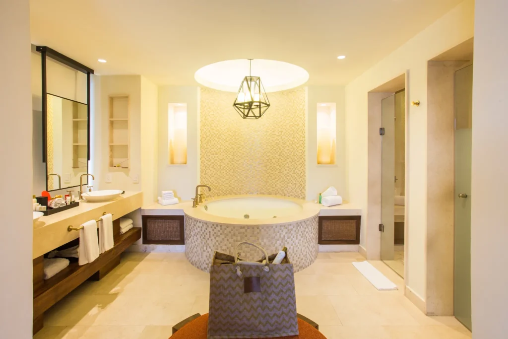 Presidential Suite bathroom with whirlpool tub for two and double sinks at Secrets Akumal Riviera Maya.