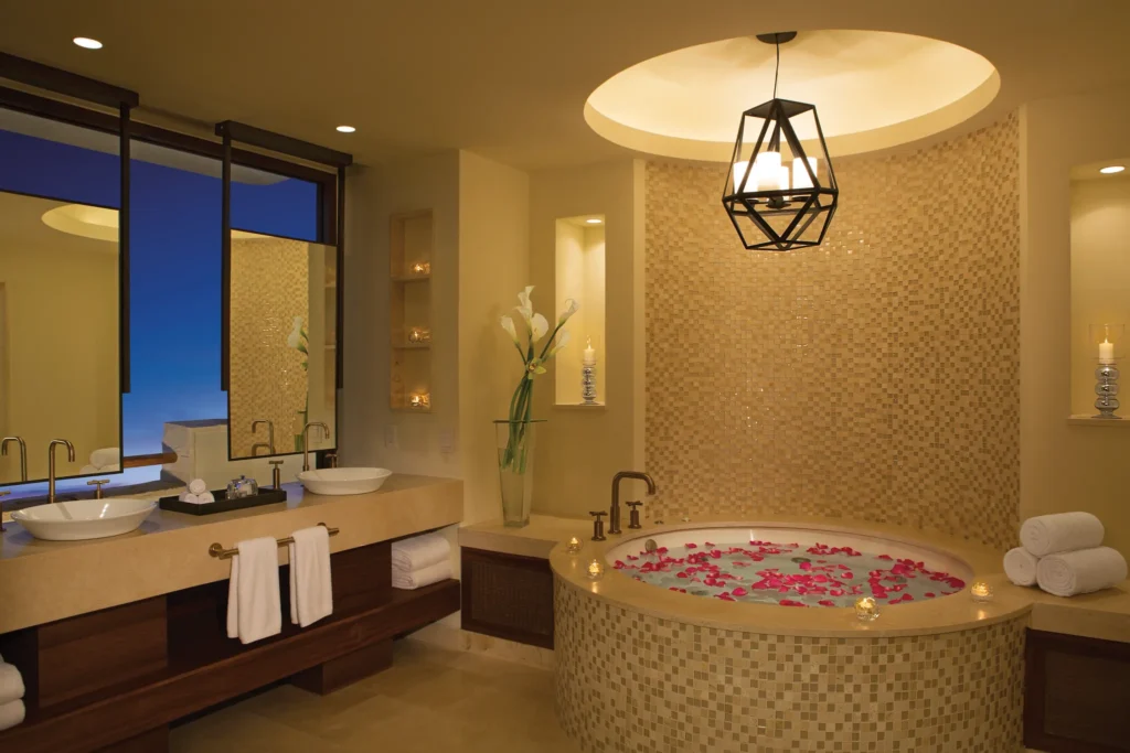 Romance Master Suite Ocean View bathroom with hot tub for two and double sinks at Secrets Akumal Riviera Maya.