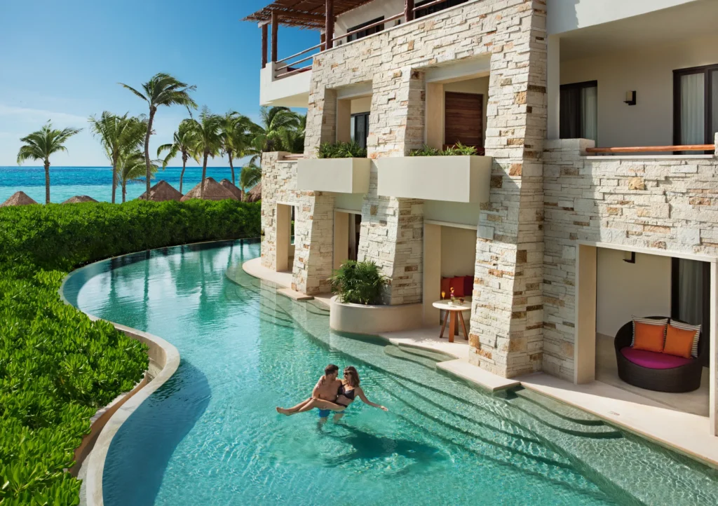 Romance Master Suite Swim Out exterior with private swim-out pool at Secrets Akumal Riviera Maya overlooking tropical gardens.