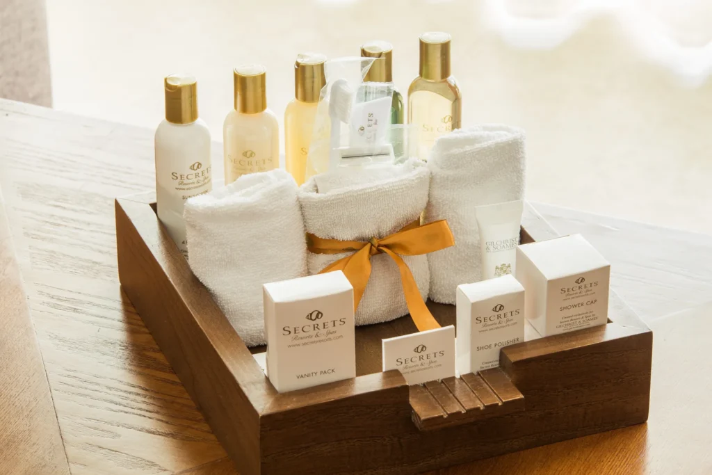 Preferred Club Junior Suite Ocean View bathroom amenities with luxury toiletries and plush towels at Secrets Aura Cozumel.