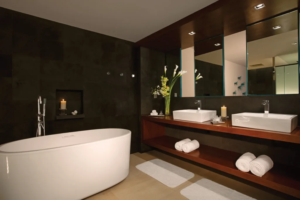 Preferred Club Superior Junior Suite Ocean View bathroom with soaking tub, dual sinks, and modern finishes at Secrets Aura Cozumel.