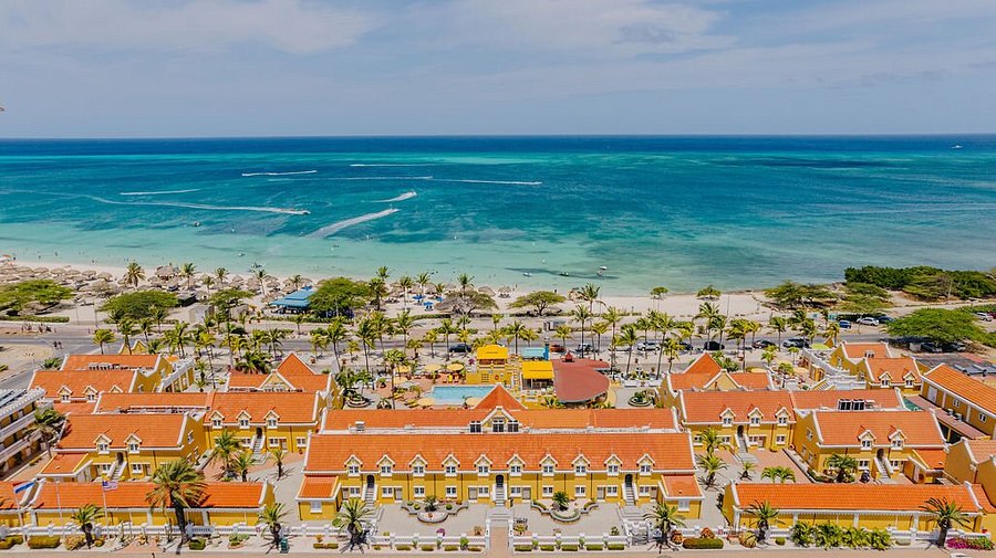 Amsterdam Manor Beach Resort boutique hotel in Aruba with Dutch colonial architecture, Eagle Beach location, and intimate courtyard setting.