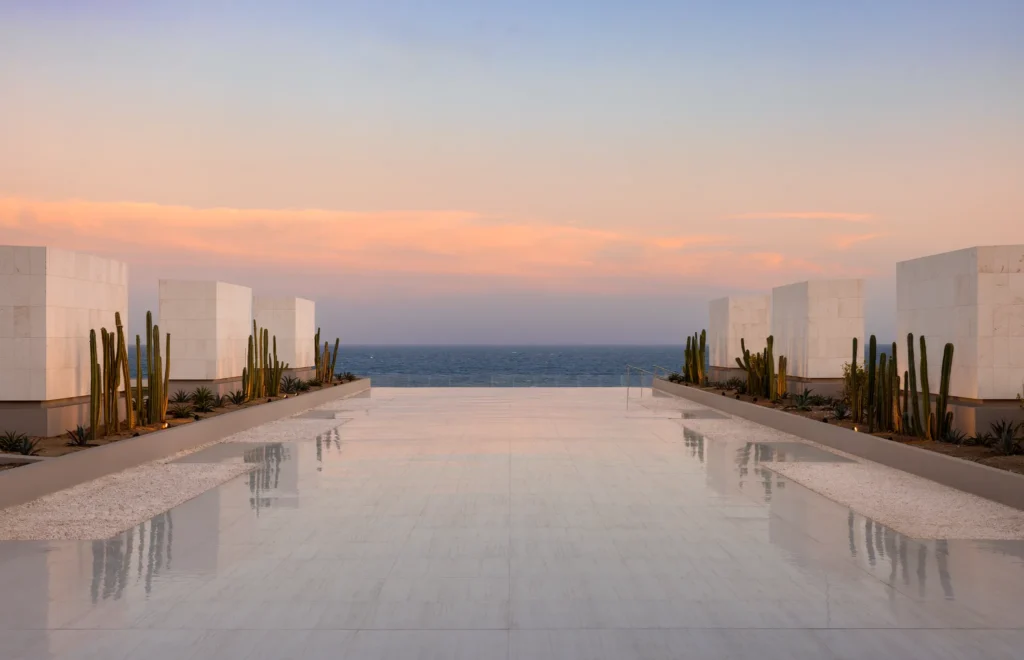 Oceanfront terrace at Secrets Baby Beach Aruba overlooking Baby Beach and the Caribbean Sea.