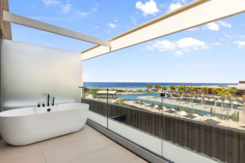 Preferred Club Junior Suite balcony with outdoor soaking tub at Secrets Baby Beach Aruba.