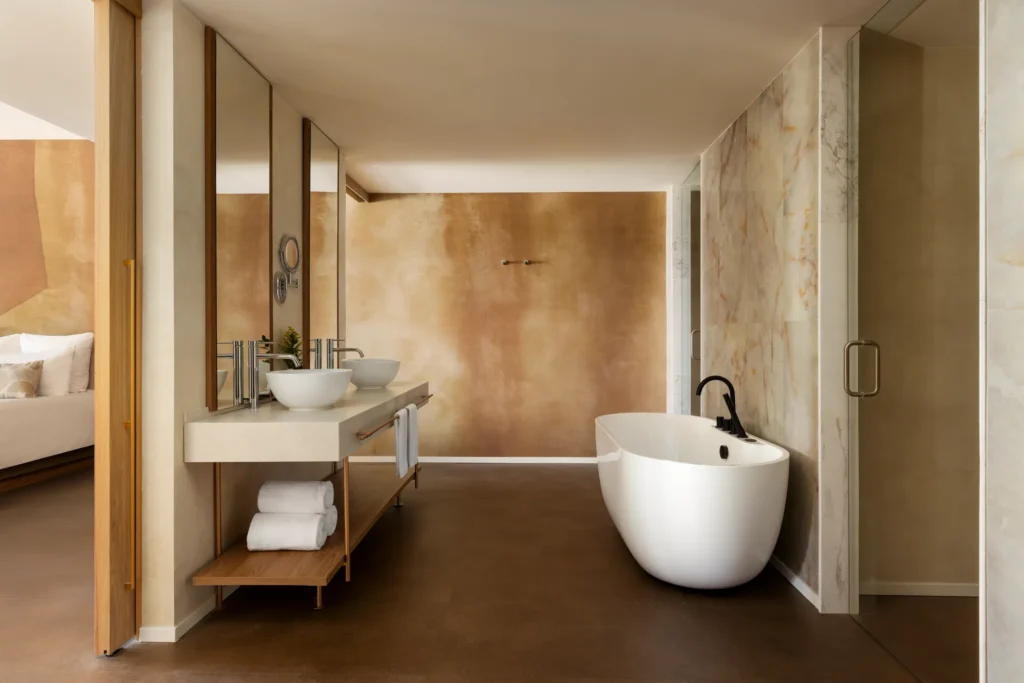 Preferred Club Master Suite Ocean View bathroom with soaking tub and double vanity at Secrets Baby Beach Aruba.