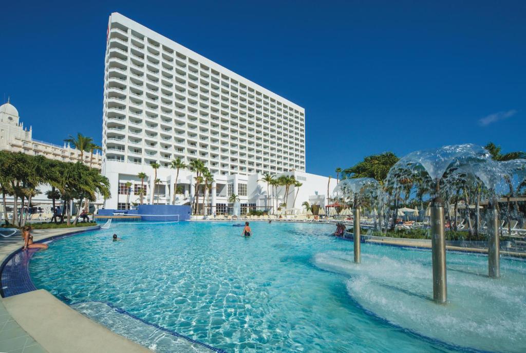 Riu Palace Antillas adults-only all-inclusive resort in Palm Beach Aruba with beachfront location and high-rise tower.