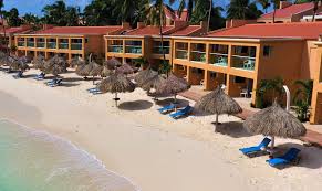 Tamarijn Aruba All Inclusive beachfront resort with palm trees, ocean views, and family-friendly atmosphere on Druif Beach.