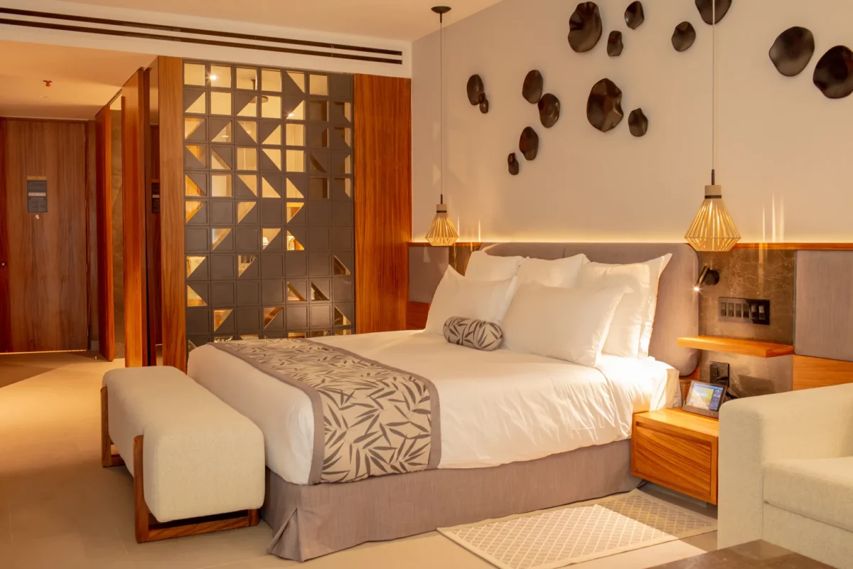 Junior Suite with king-size bed and modern décor at Secrets Bahia Mita Surf & Spa Resort.